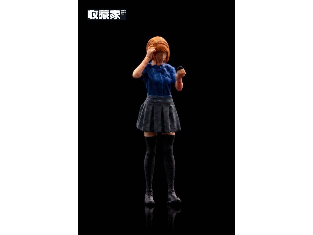 Figure: Girl holding a hand mirror (in a blue dress)